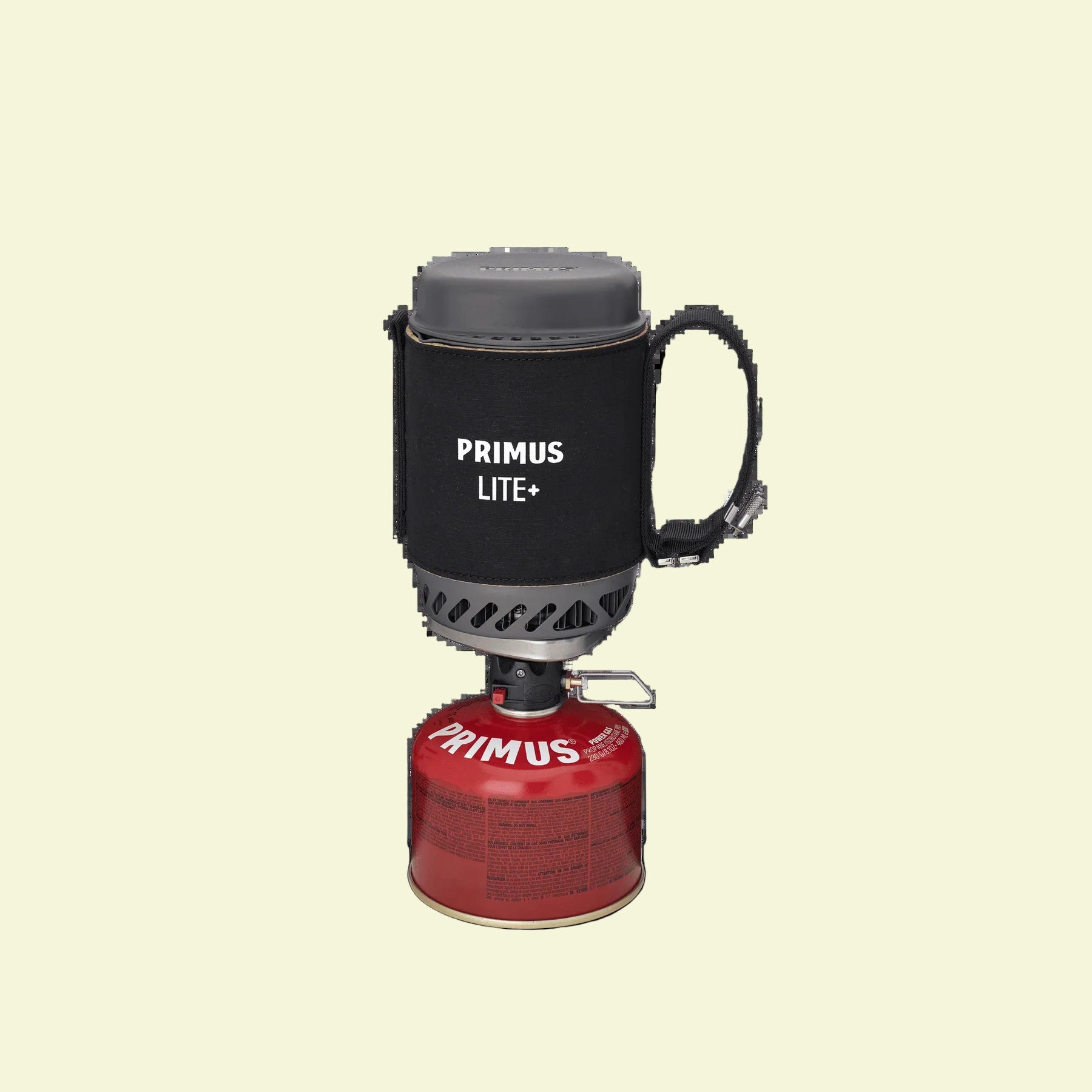 Primus Lite+ camping stove with red fuel canister on a white background