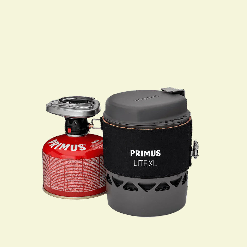 Primus Lite XL camping stove with fuel canister on a white background