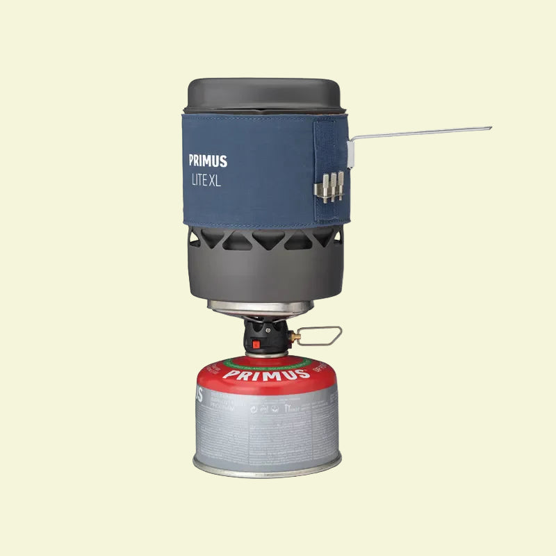 Primus Lite XL camping stove with fuel canister on a white background