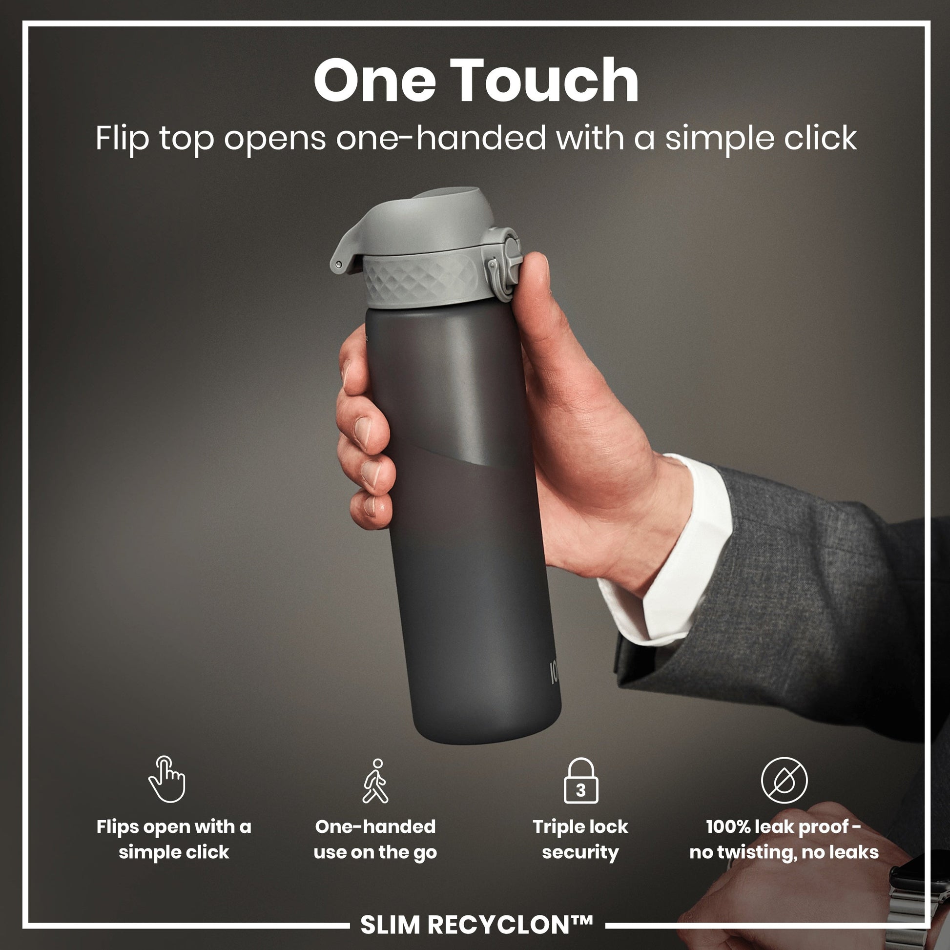 Hand holding a black water bottle with gray flip top, featuring text about bottle's features.