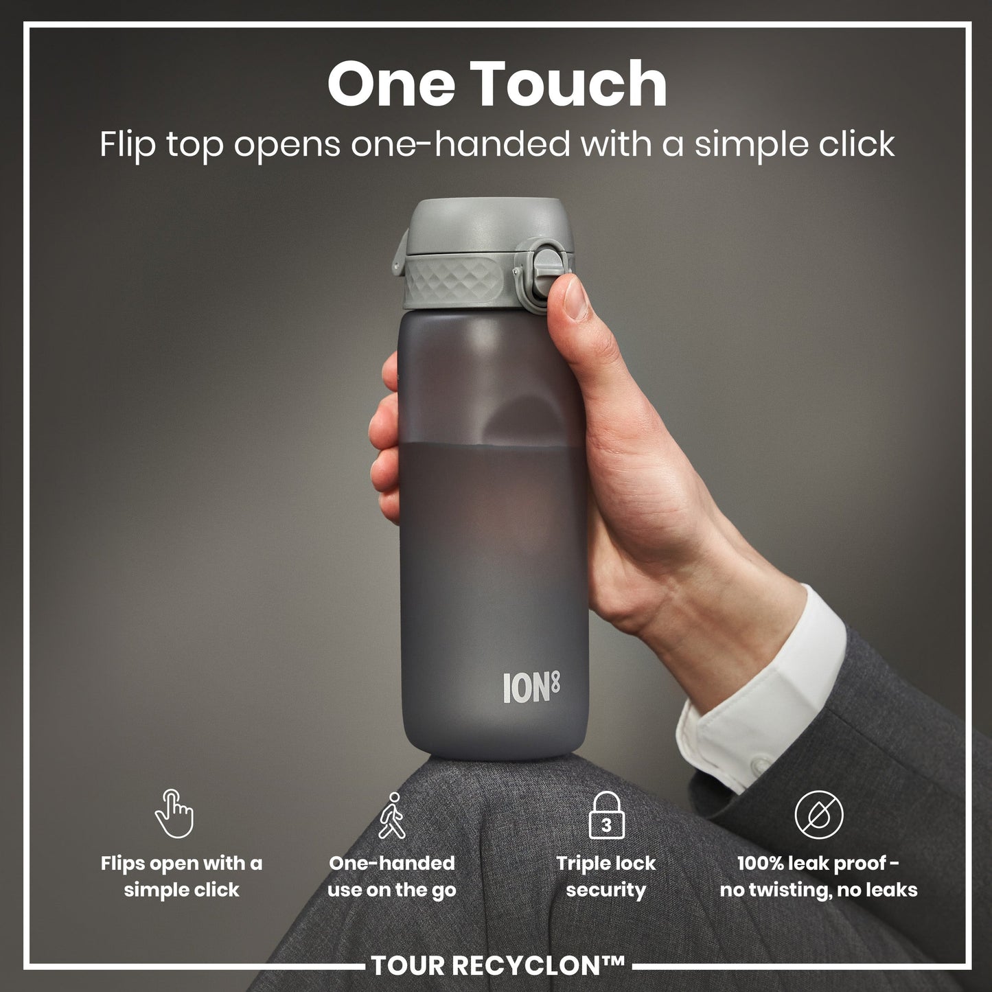Hand holding a grey water bottle with 'ION8' branding against a dark background