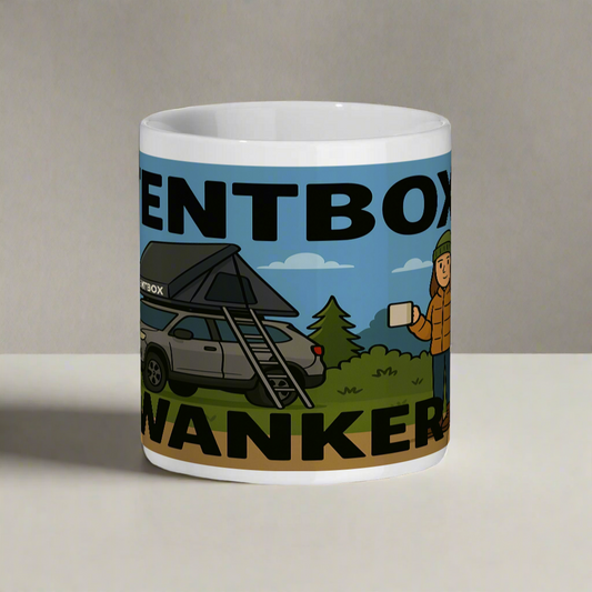 Mug with a graphic design of a car with a roof tent and a person holding a coffee cup, set against a white background.