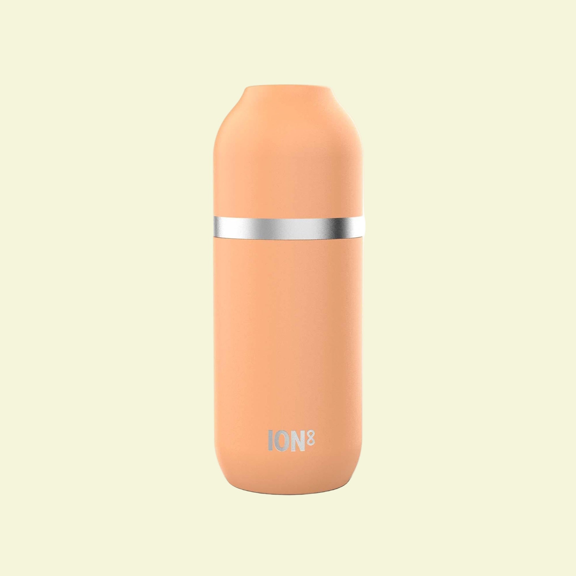 Peach-colored thermos with silver band on a white background