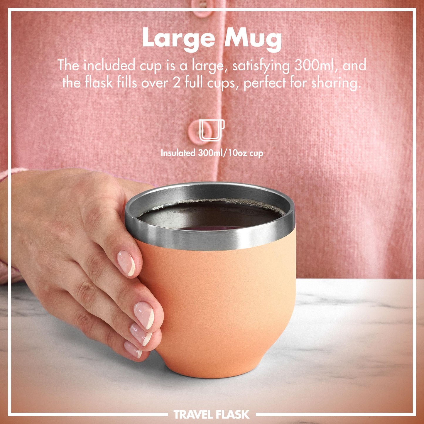 Orange travel mug with silver lid held by a hand, against a pink background.