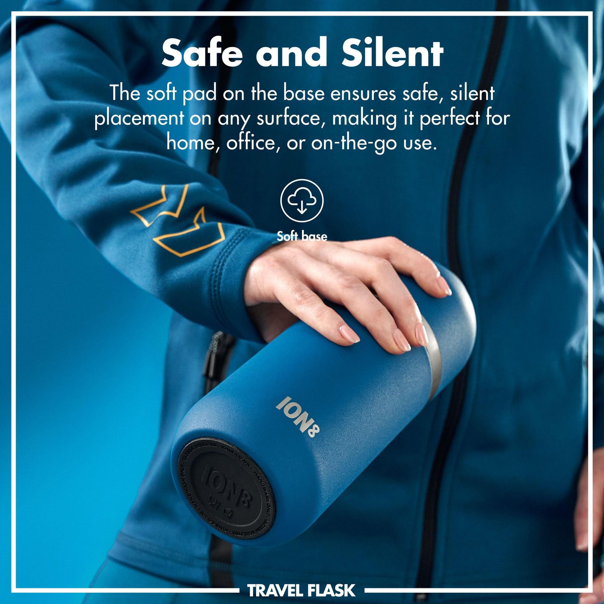 Person holding a blue travel flask with text about its safe and silent design.
