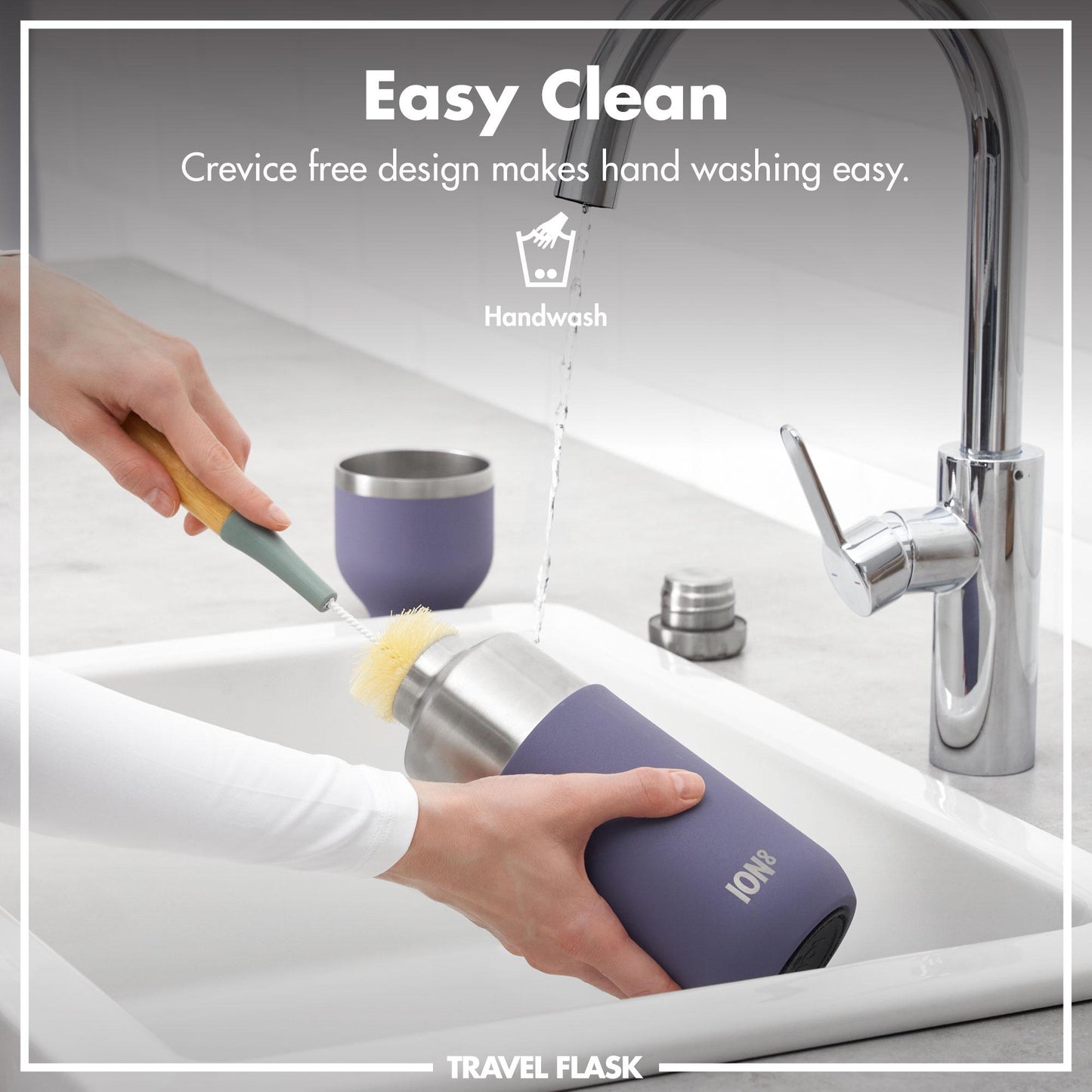 Purple travel flask being used to clean utensils in a sink with text 'Easy Clean' and 'Crevice free design makes hand washing easy'.