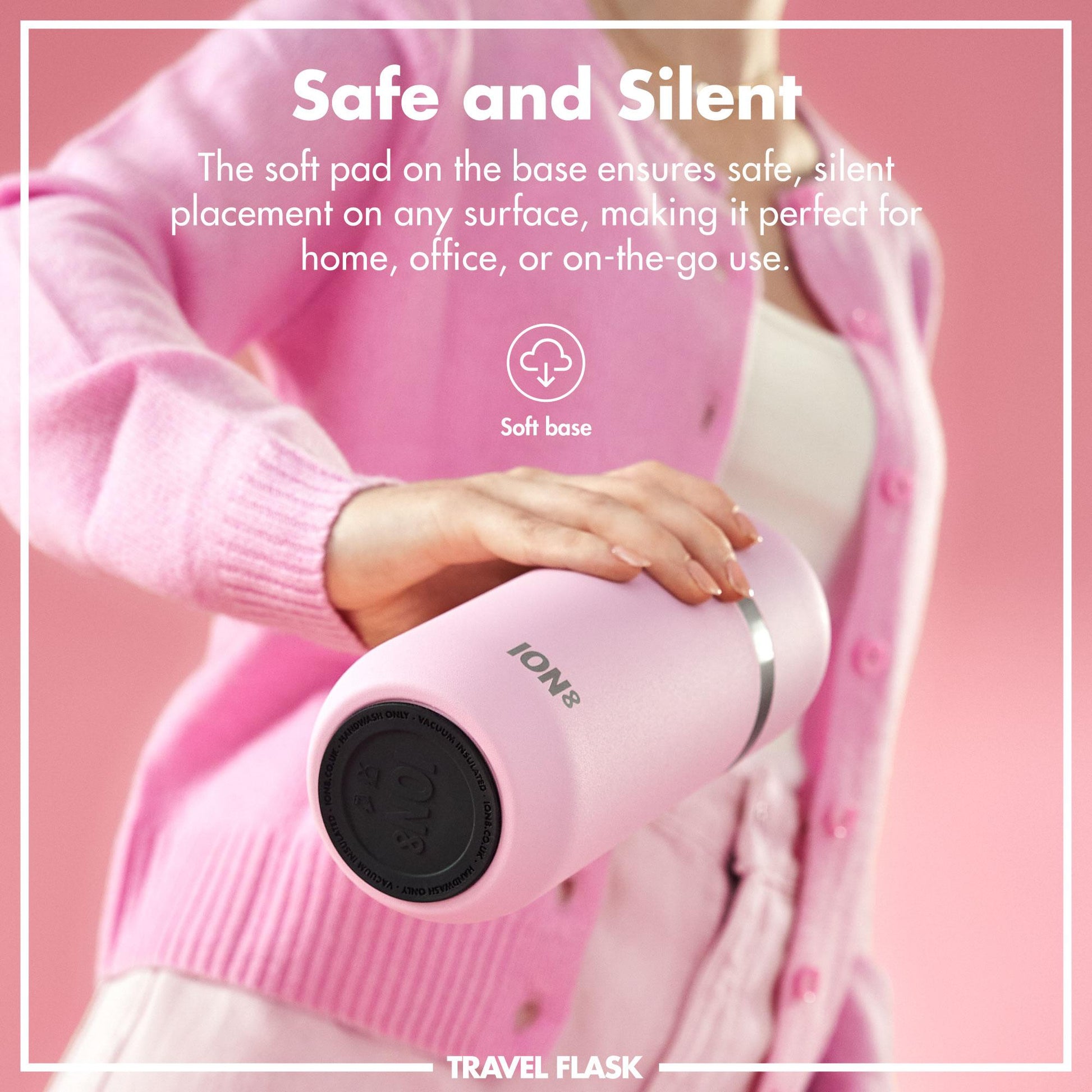 Person holding a pink travel flask with text about its safe and silent design on a pink background.