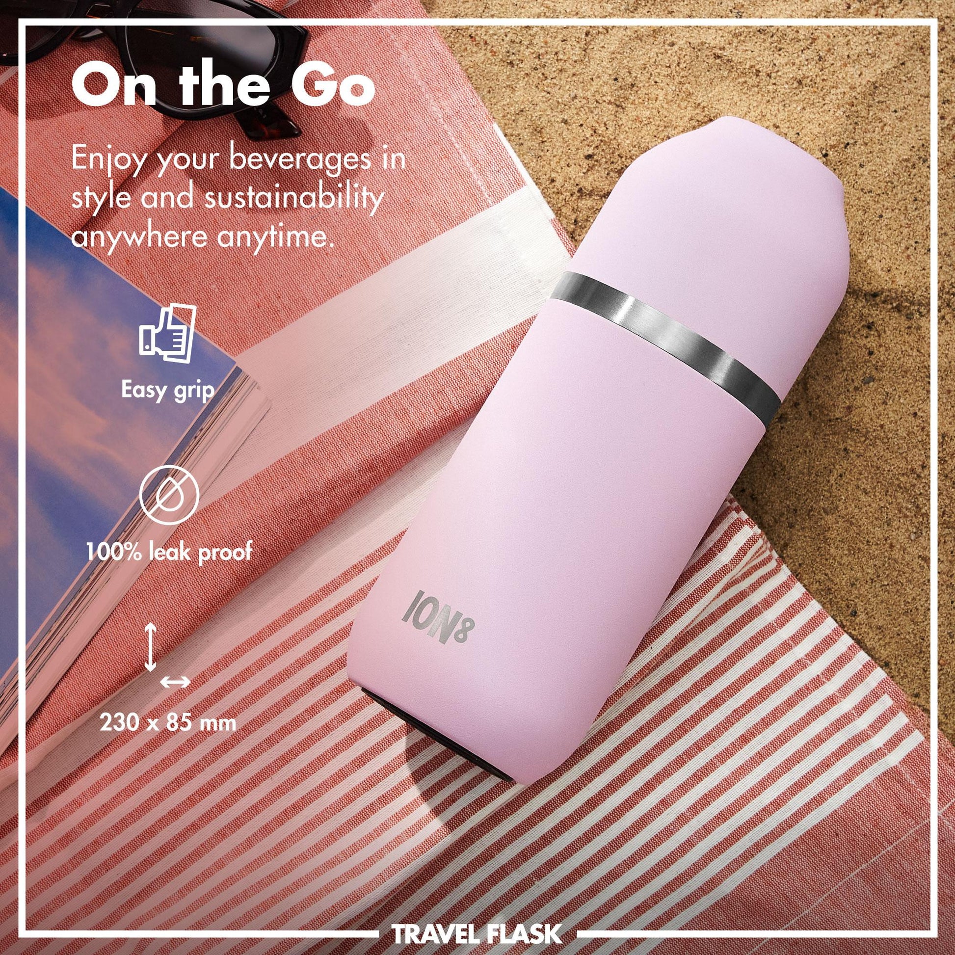 Pink travel flask on a beach towel with promotional text about its features.