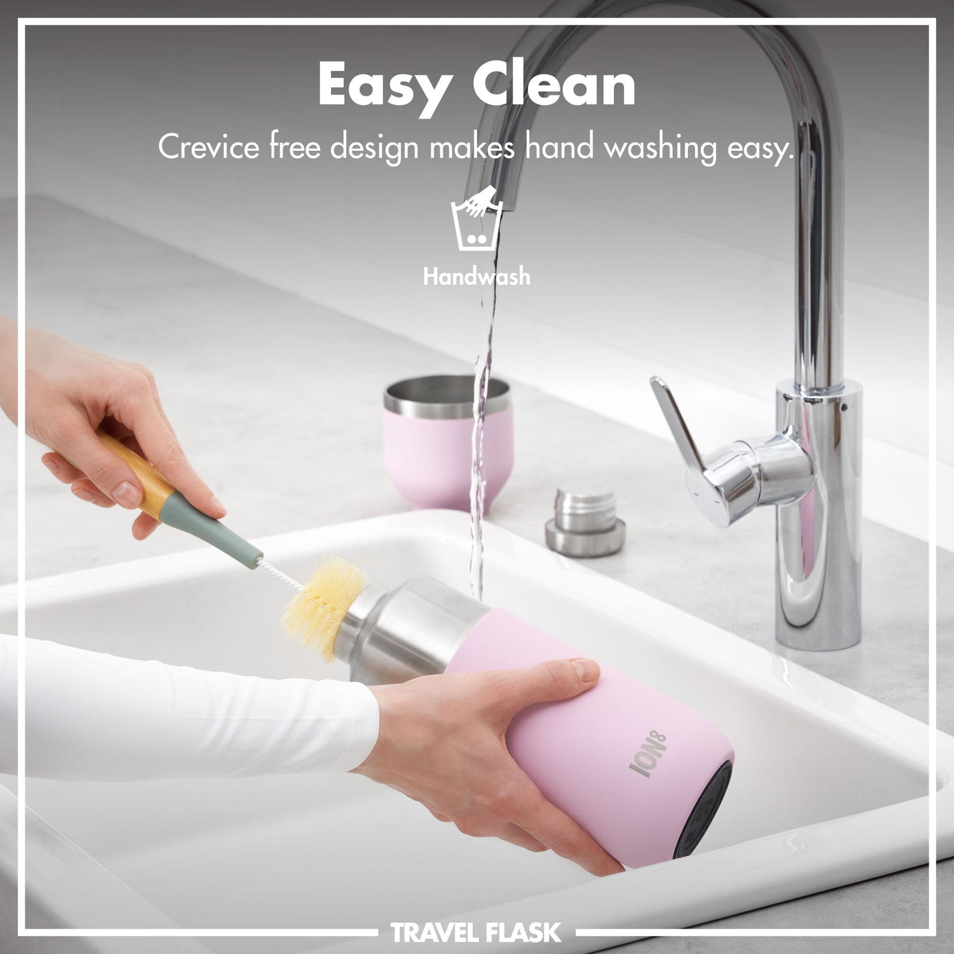 Person cleaning a pink travel flask with a brush in a sink, labeled 'Easy Clean'.