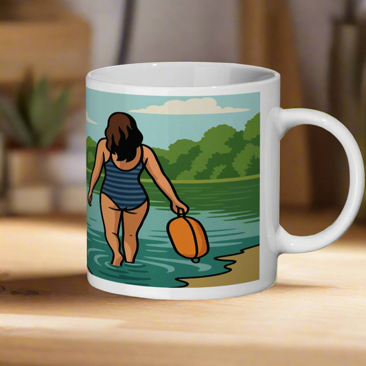 Mug with a graphic of a woman in a swimsuit walking along a lakeshore.