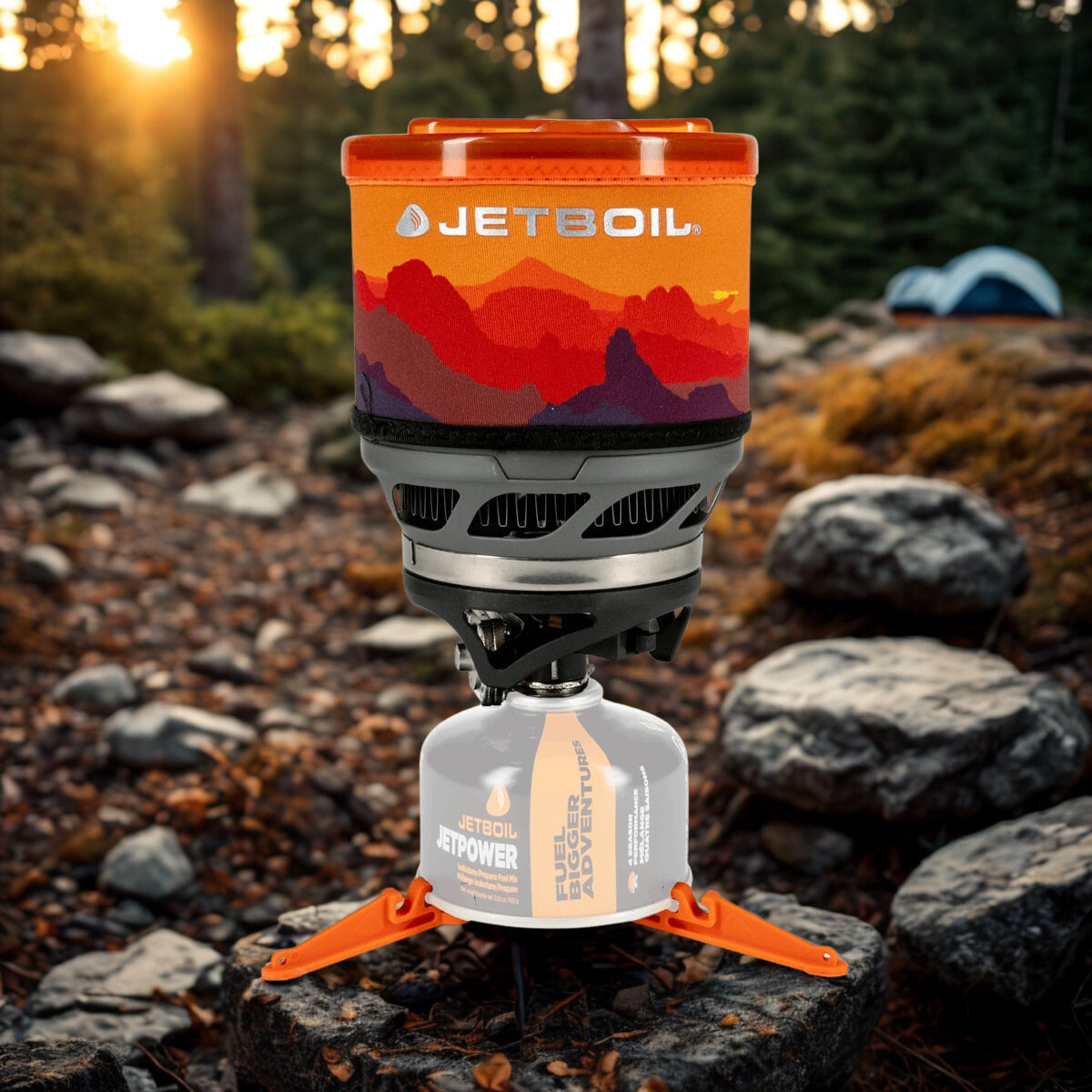 Jetboil stove with scenic design on top, set against a natural outdoor background.