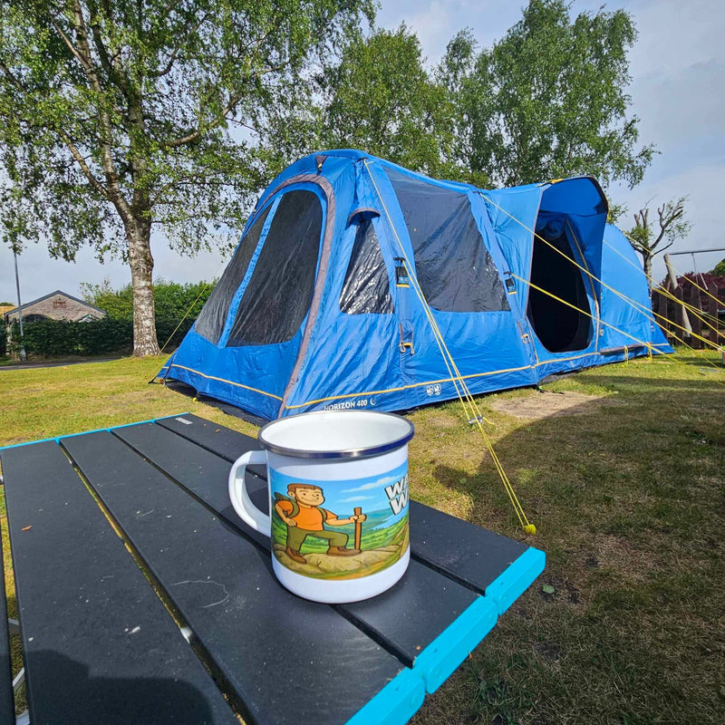Wainwright wanker enamel mug on campsite 