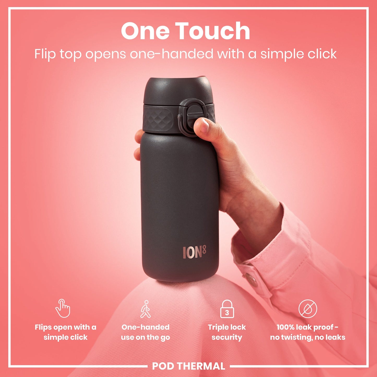 Black water bottle held by a hand with 'IONS' branding on a pink background