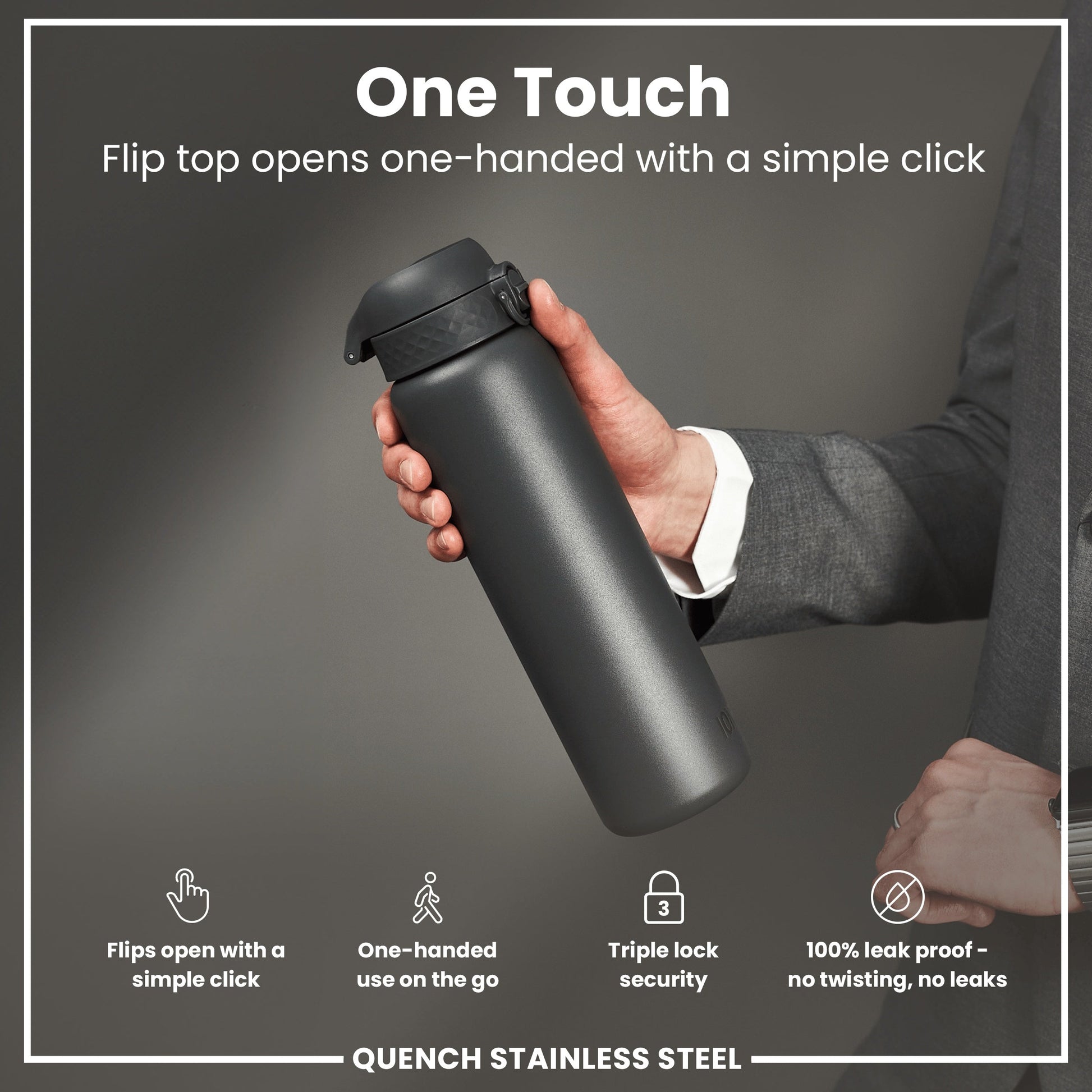 Person holding a black stainless steel water bottle with text highlighting features on a gray background