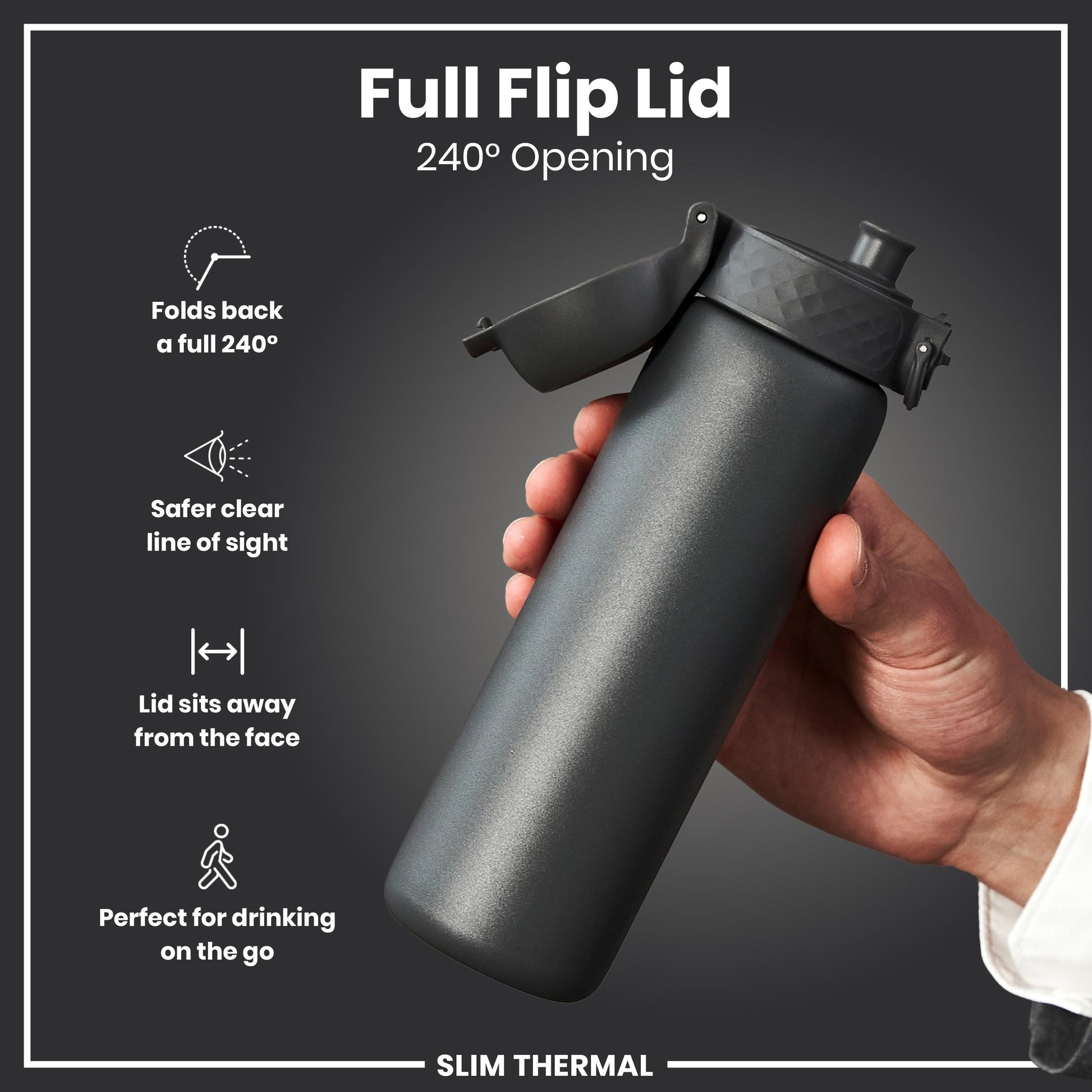 Black insulated bottle with full flip lid held by a hand on a dark background