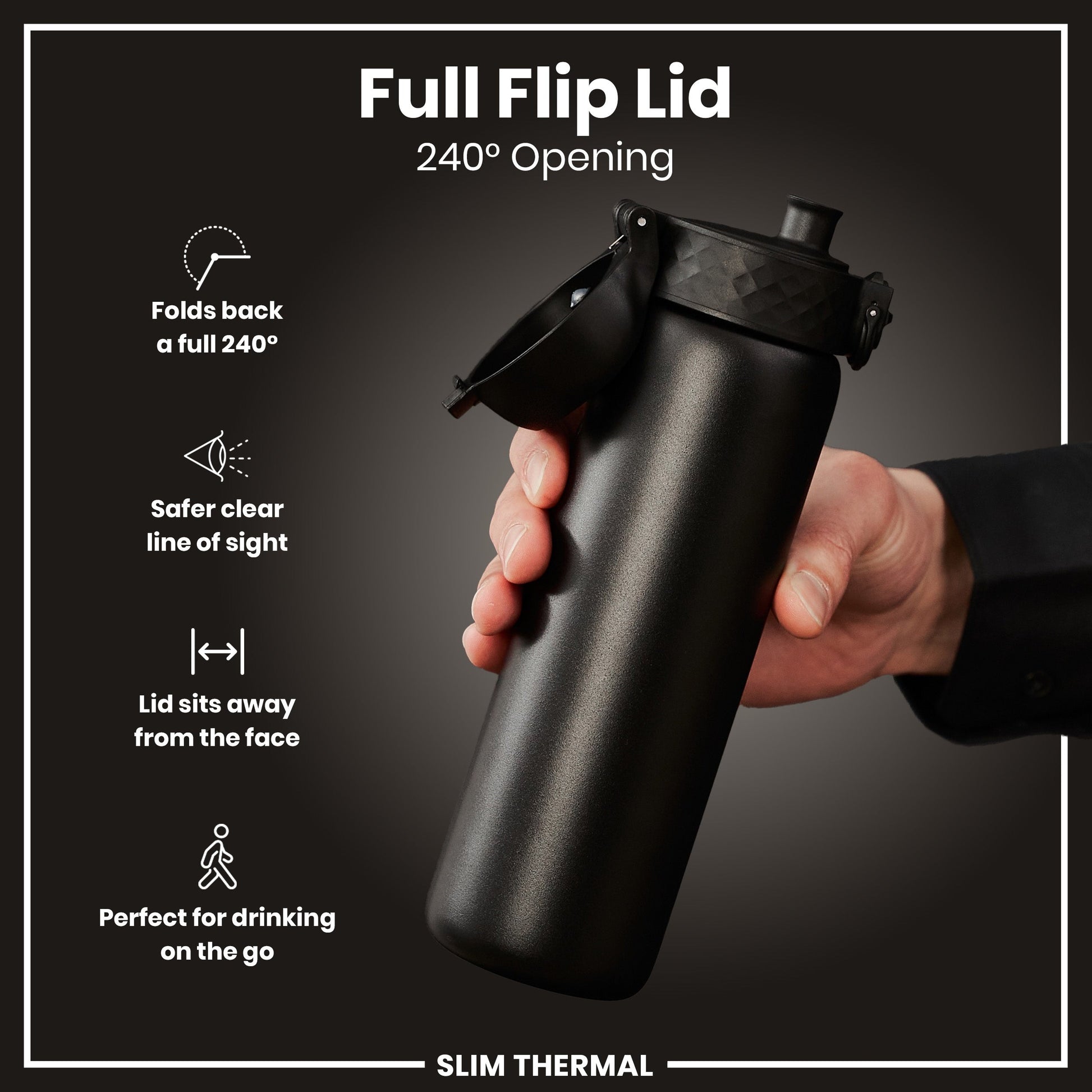 Black water bottle with full flip lid held by a hand on a dark background