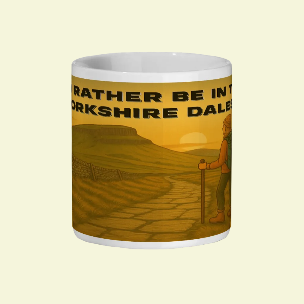 White ceramic 11oz mug with yellow hiking design and "I'd Rather Be in the Yorkshire Dales" text.