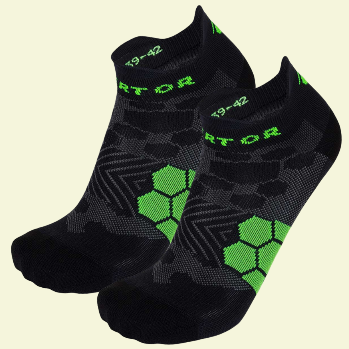 Two pairs of black socks with green patterns and branding on a white background