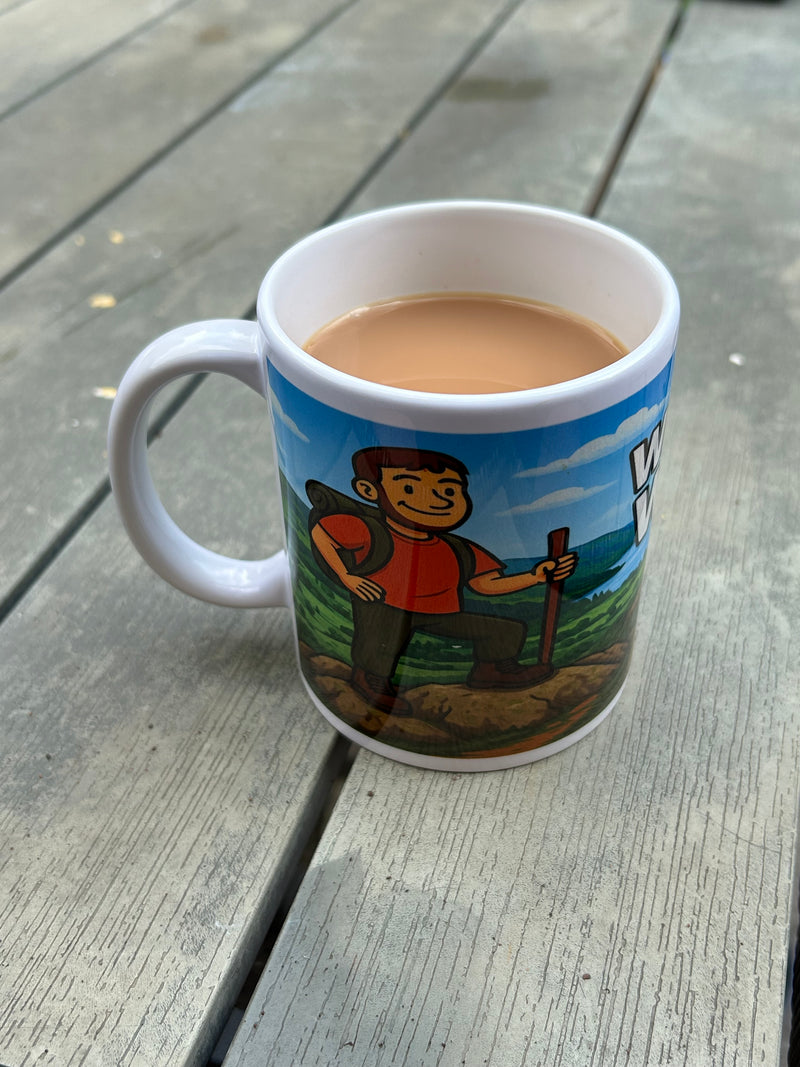 Wainwright Wanker Ceramic mug on garden table 