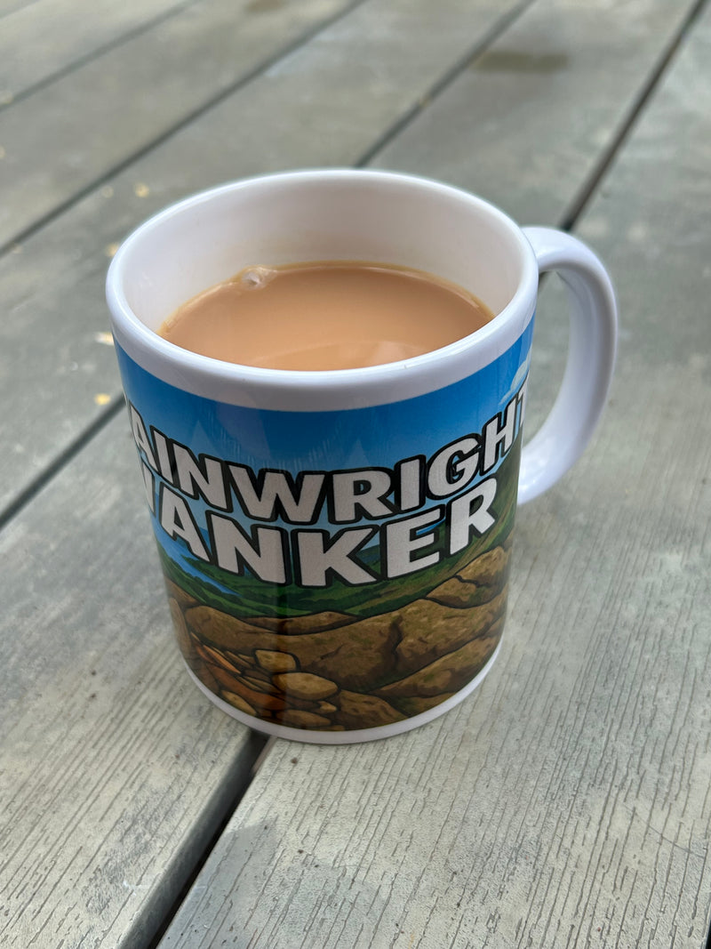 Wainwright Wanker Ceramic mug on garden table 