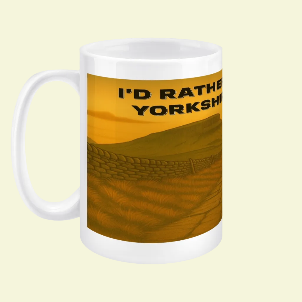 White ceramic mug with a golden-yellow Yorkshire Dales landscape and bold black text.