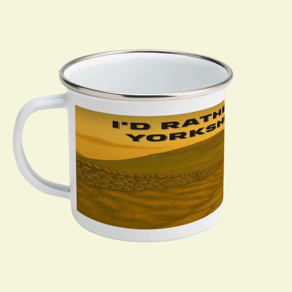White enamel mug with silver rim featuring "I'd Rather Be in Yorkshire Dales" text over brown landscape design.