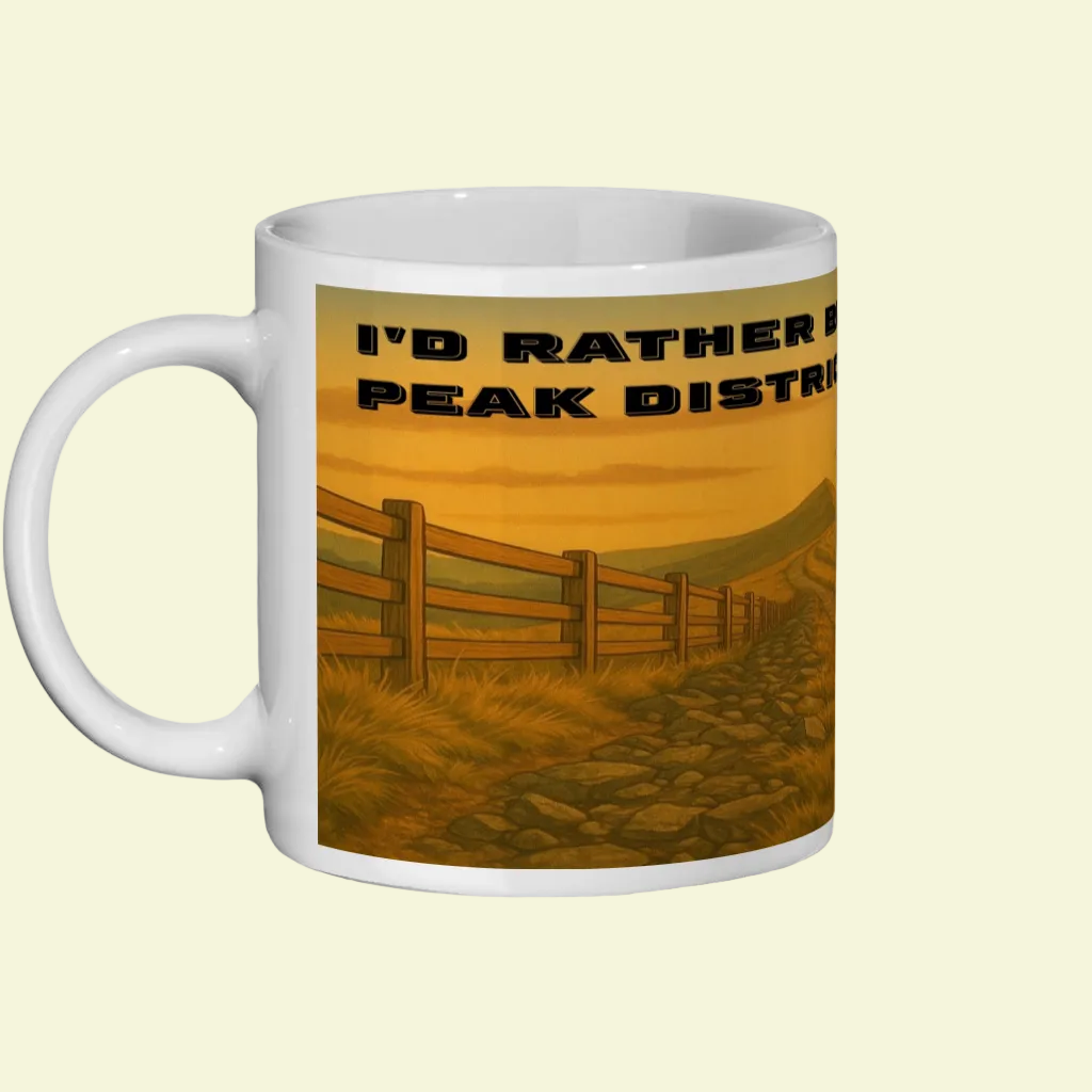 White ceramic 11oz mug with orange countryside trail and "I'd Rather Be in the Peak District" text.