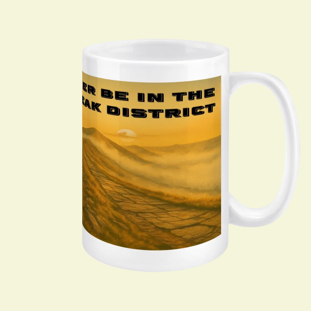 White ceramic mug with orange and brown Peak District landscape and black text saying "I'd Rather Be In The Peak District".
