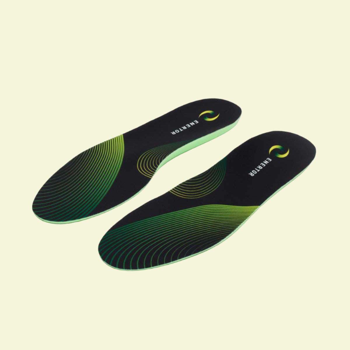 Pair of black and green shoe insoles on a white background