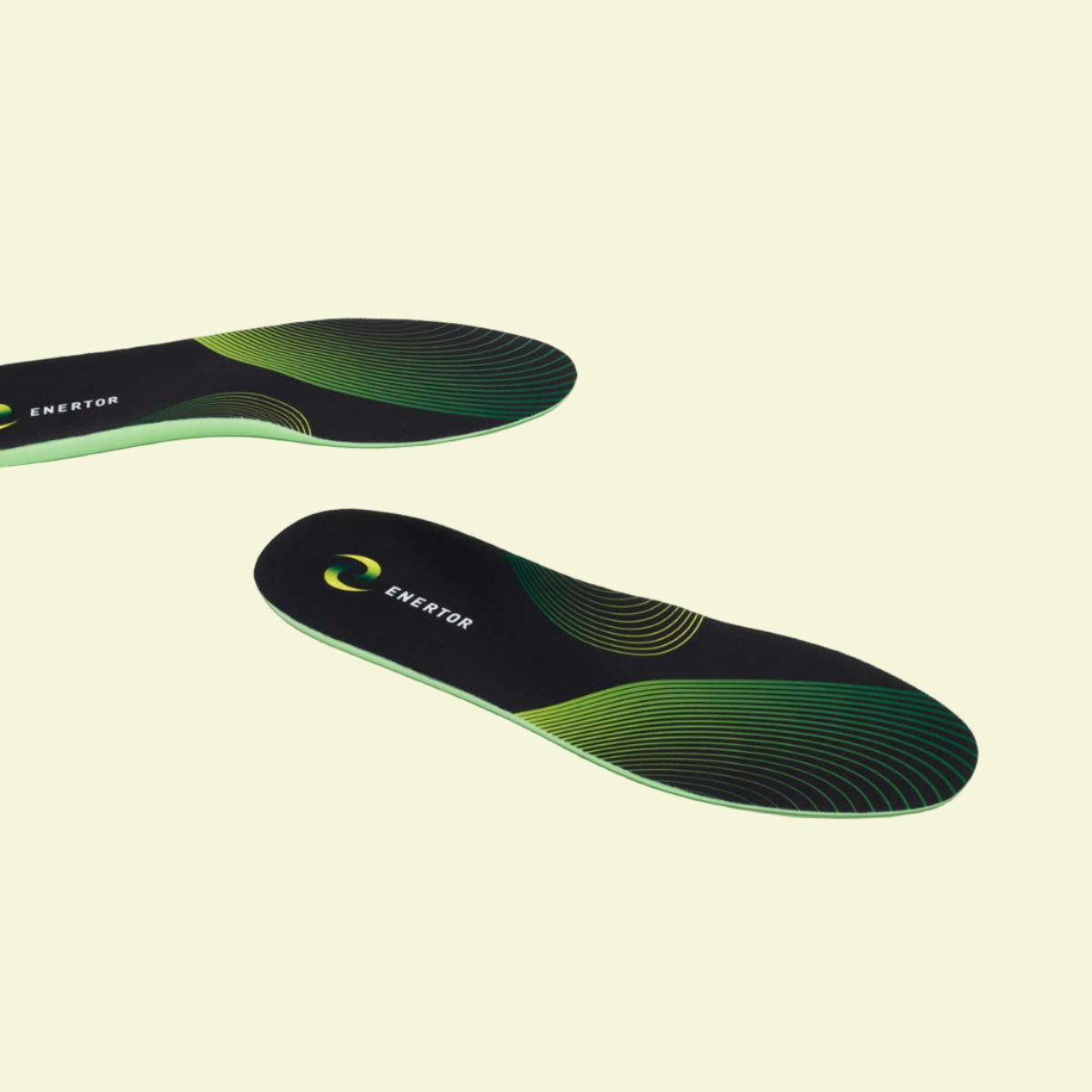 Green and black shoe insole with 'Exertor' branding on a white background