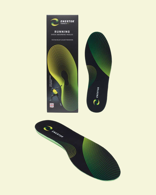 Green and black shoe insoles with packaging on a white background