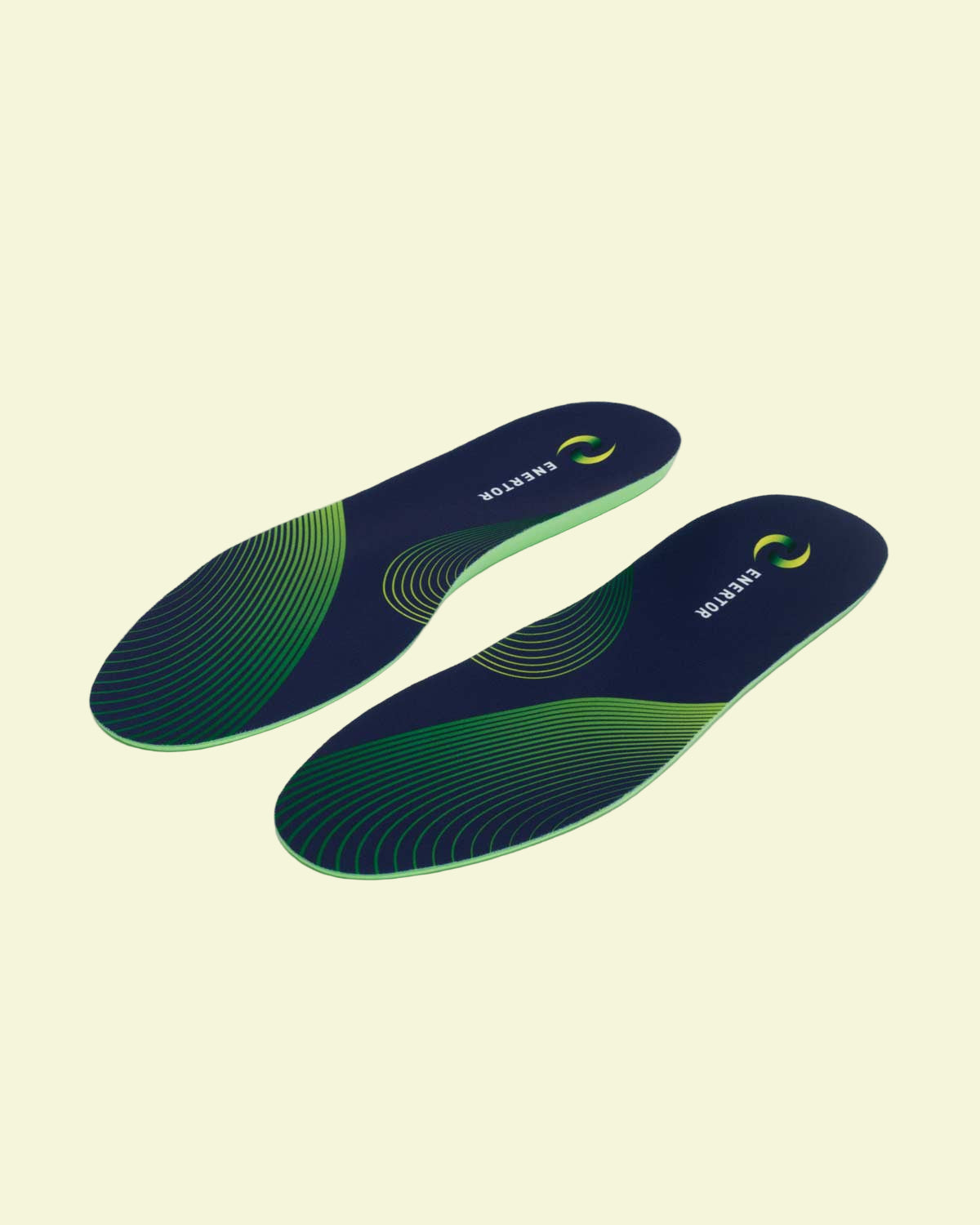Pair of blue and green shoe insoles on a white background