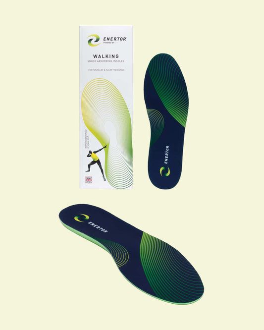 Two green and black shoe insoles with packaging on a white background