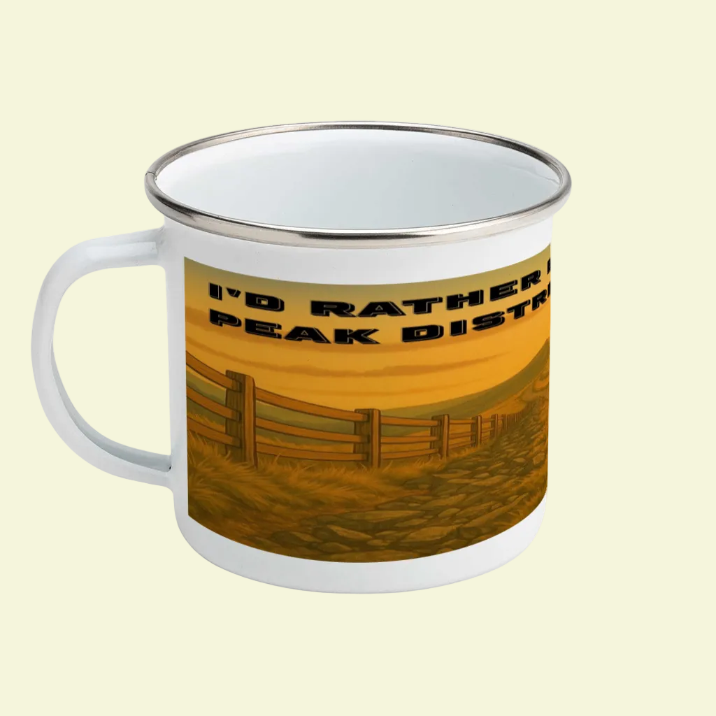 White enamel mug with silver rim featuring a sunset Peak District landscape and bold black text.