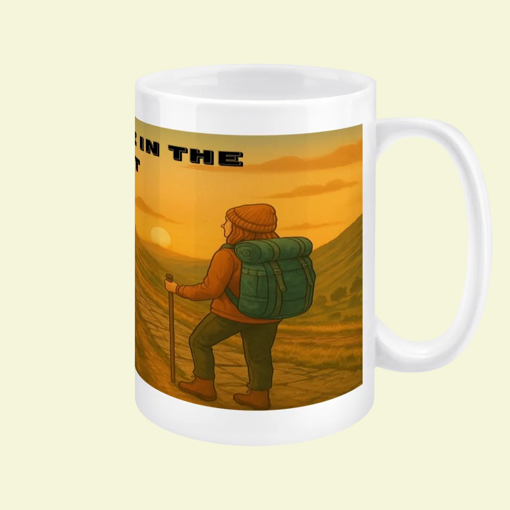 White ceramic mug featuring a hiker with backpack at sunset in the Peak District design.