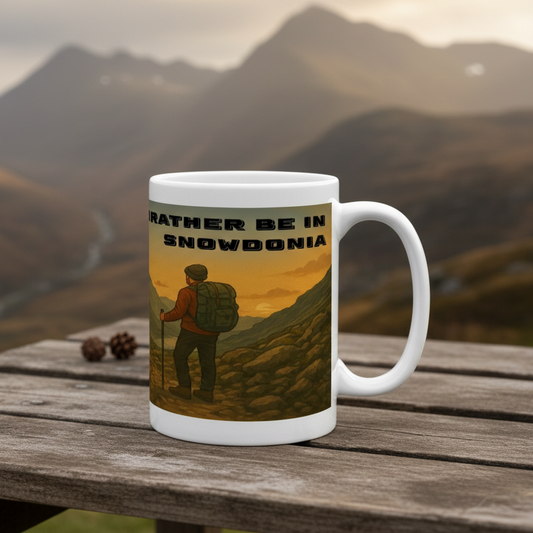 White ceramic 15oz mug with hiker illustration and "I'd Rather Be in Snowdonia" text in black.